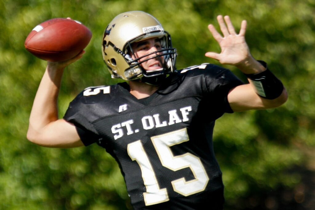 A quarterback throwing a pass