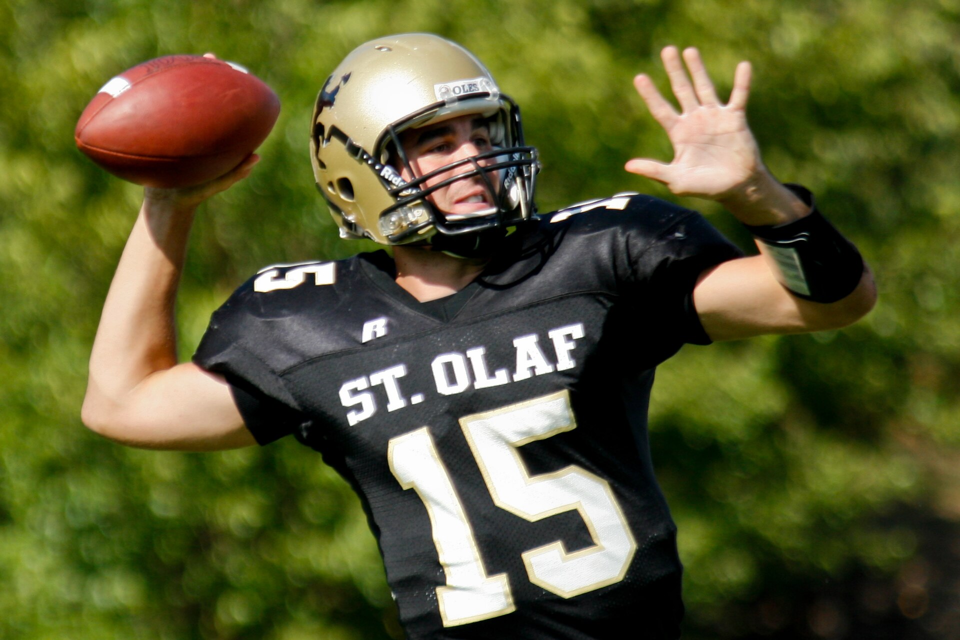 A quarterback throwing a pass