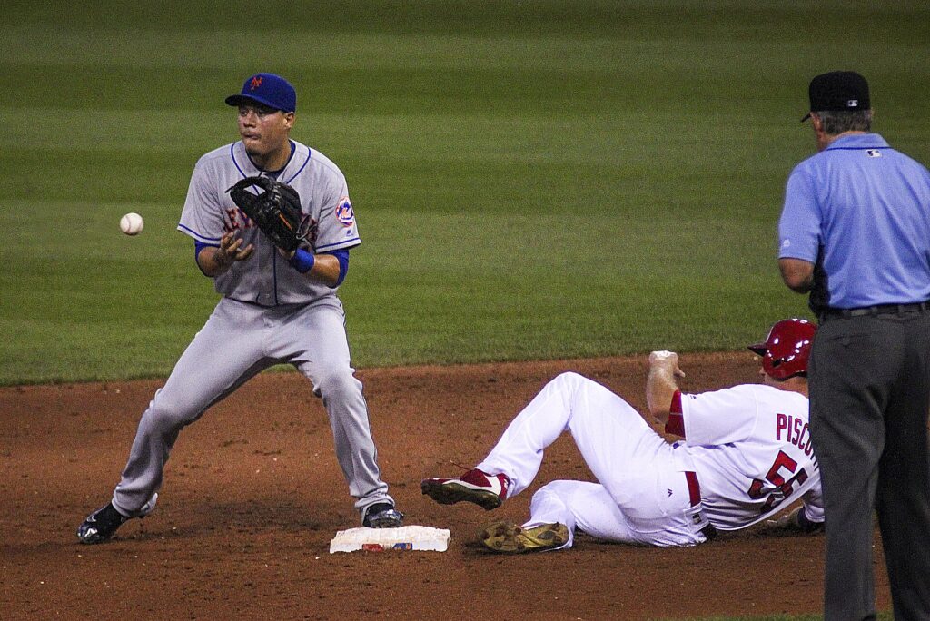 A runner sliding into a base