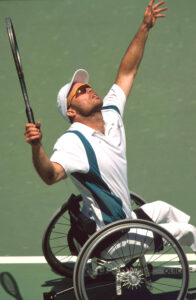 A tennis player serving