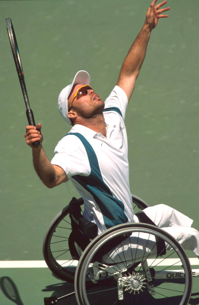 A tennis player serving