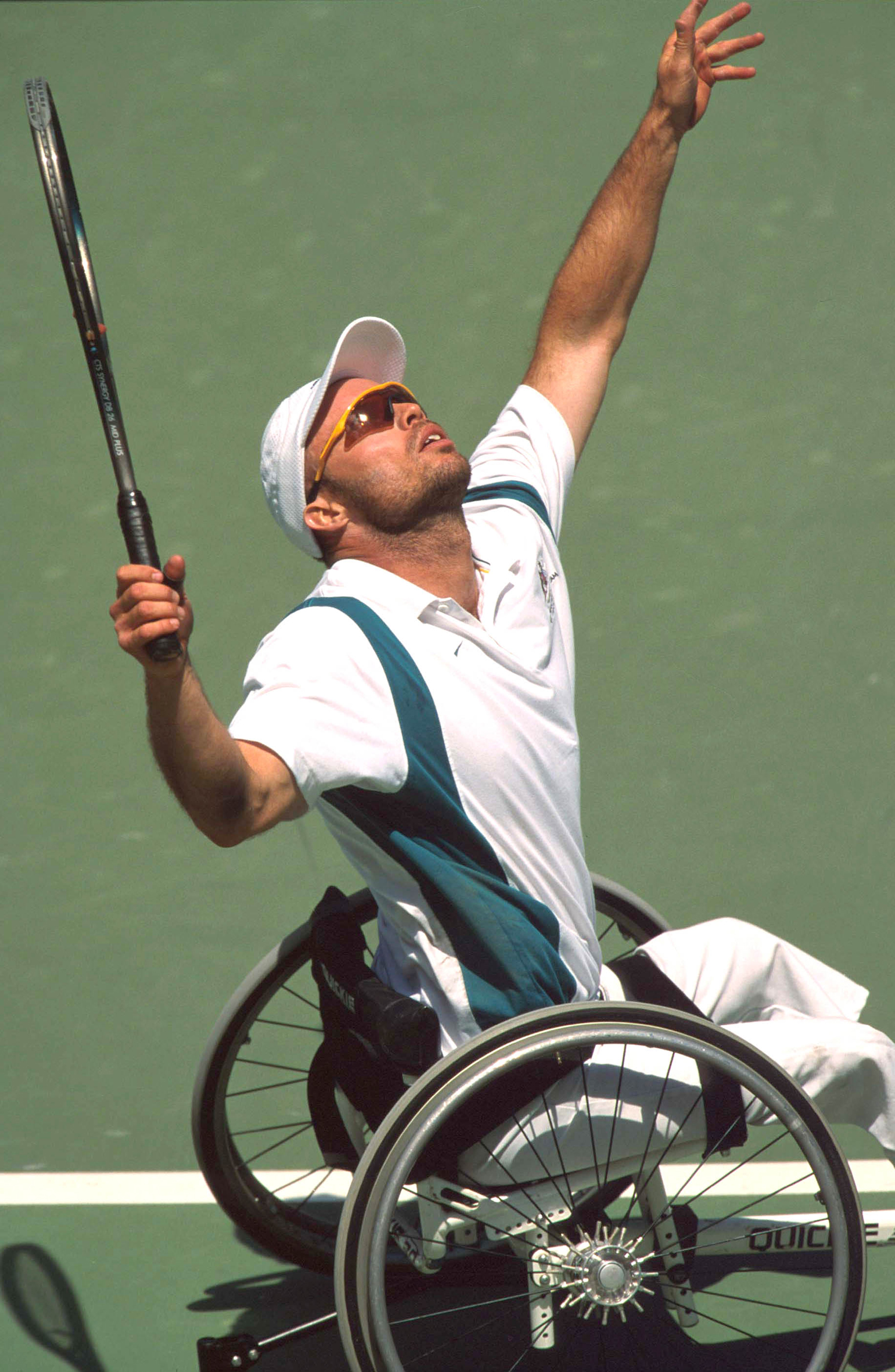 A tennis player serving